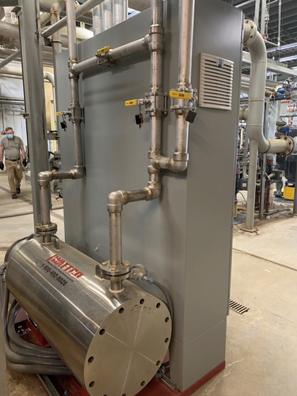 A silver steam heating system in a factory